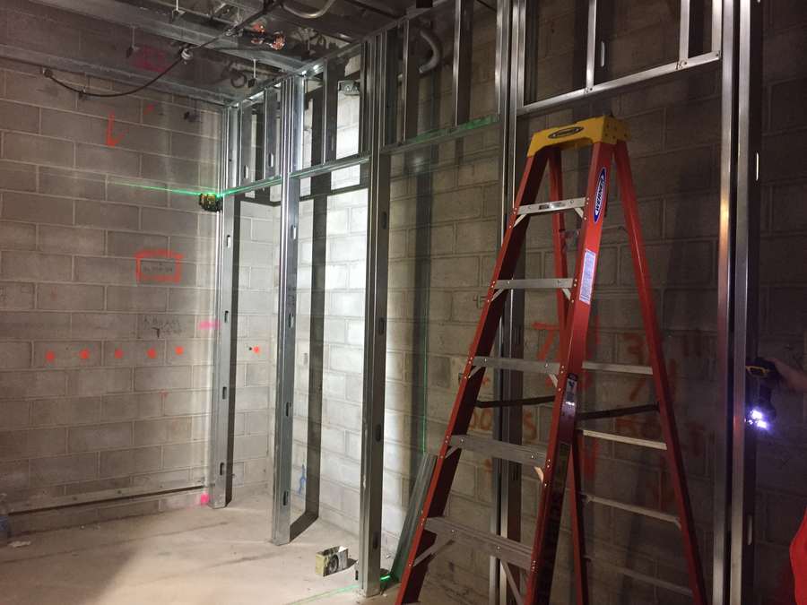 Sample photo: steel stud wall going up along a laser line.