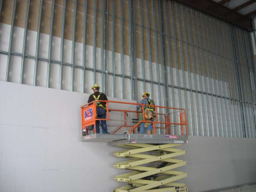 Sample photo: tall steel stud wall, half boarded.